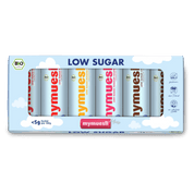 Eine „Low Sugar“ Probiermix-Box mit sechs kleinen mymuesli -Dosen in verschiedenen Farben auf grünem Untergrund.