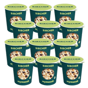 Elf dunkelgrüne mymuesli Portionsbecher der Sorte „Bircher Müsli“ sind in mehreren Reihen ordentlich aufgestellt.